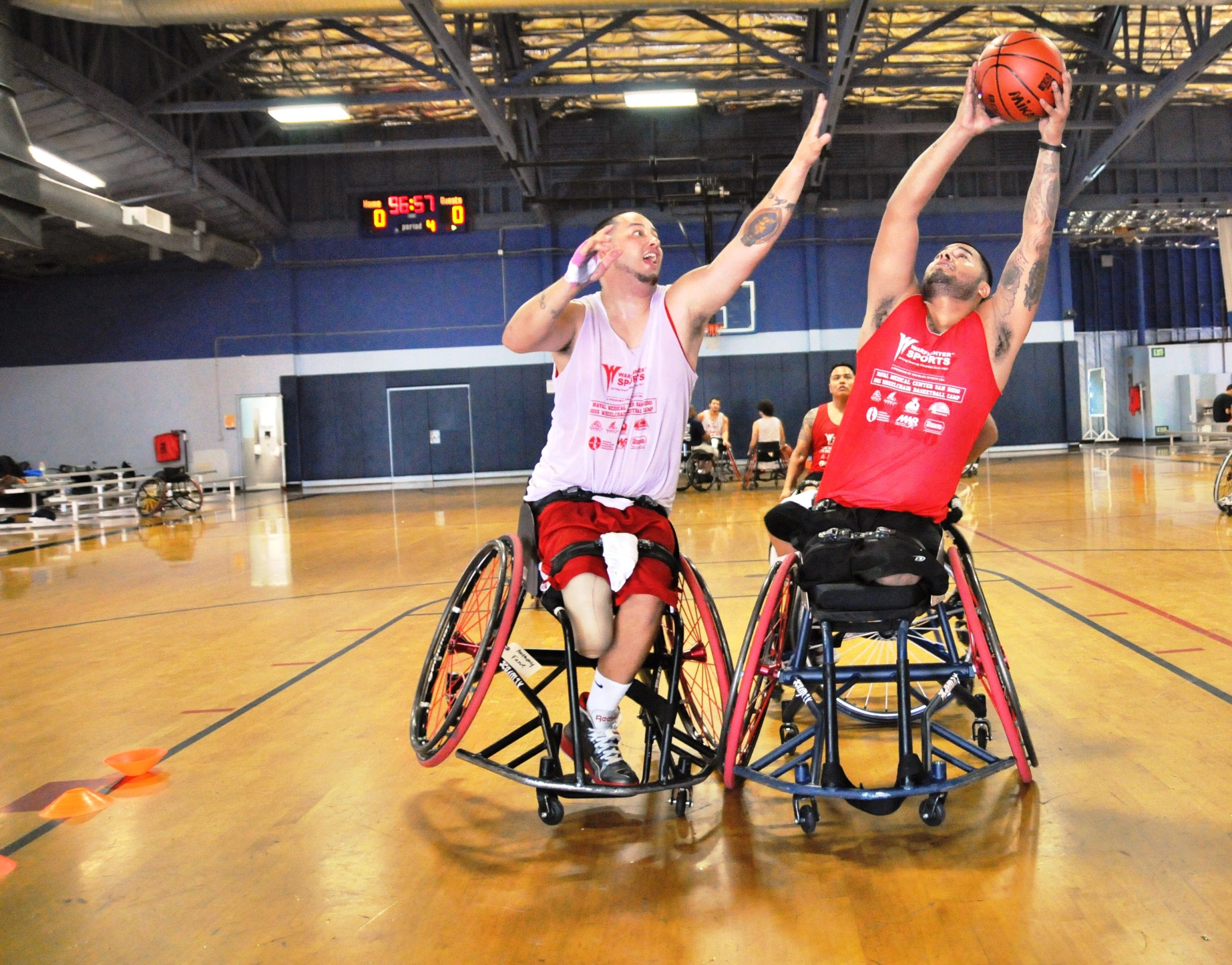 Two athletes playing wheelchair basketball