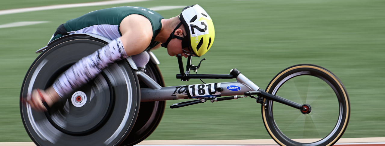 Athlete racing in racing wheelchair