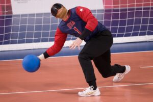 Male goalball player throwing the ball