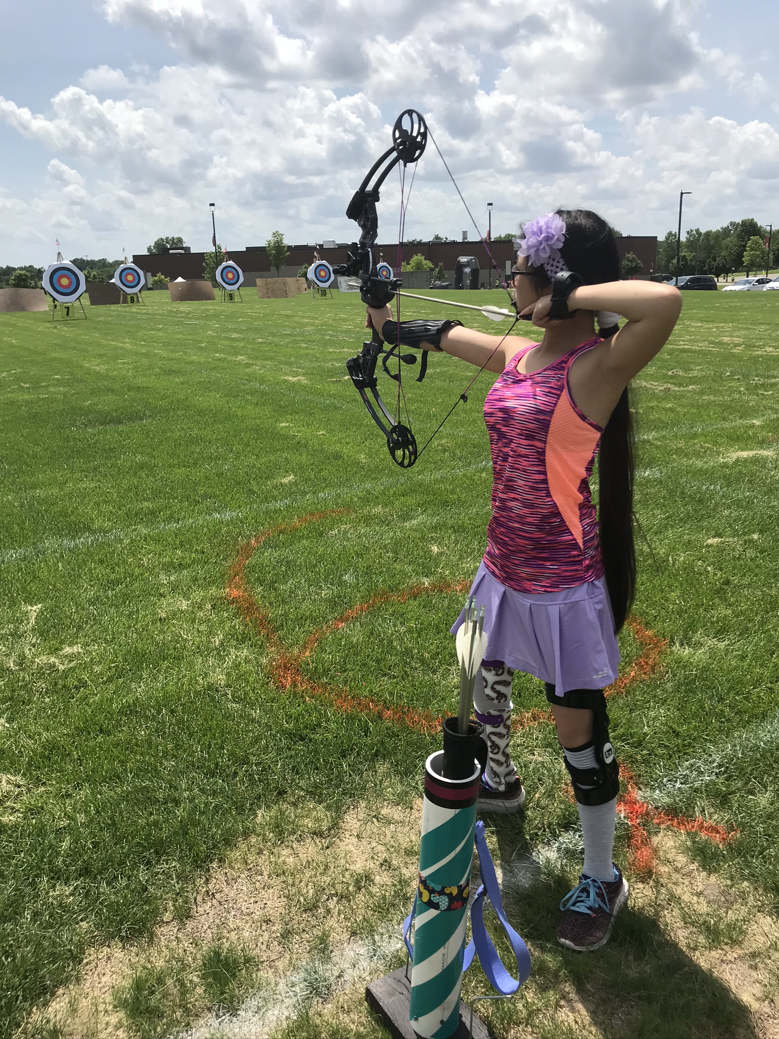 Female athlete aiming in archery