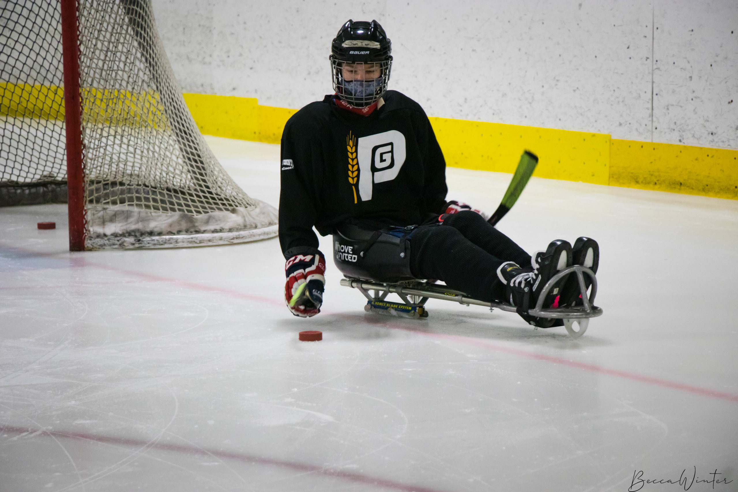 Athlete playing sled hockey