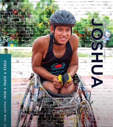 Male athlete in wheelchair smiling at camera