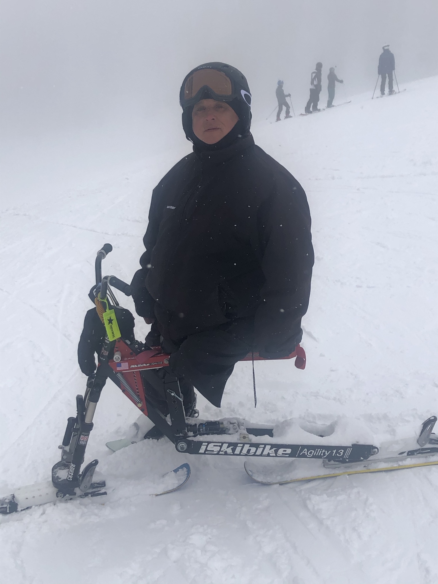Athlete posed looking at the camera on a ski bike
