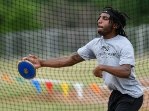 adaptive black male athlete throwing a discus