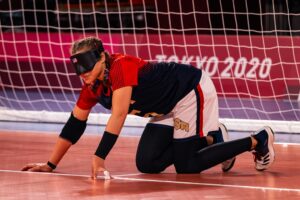 Female goalball player on the court ready to defend