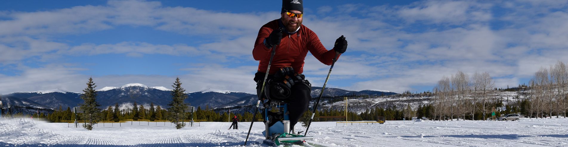 Athlete on mono-ski skiing