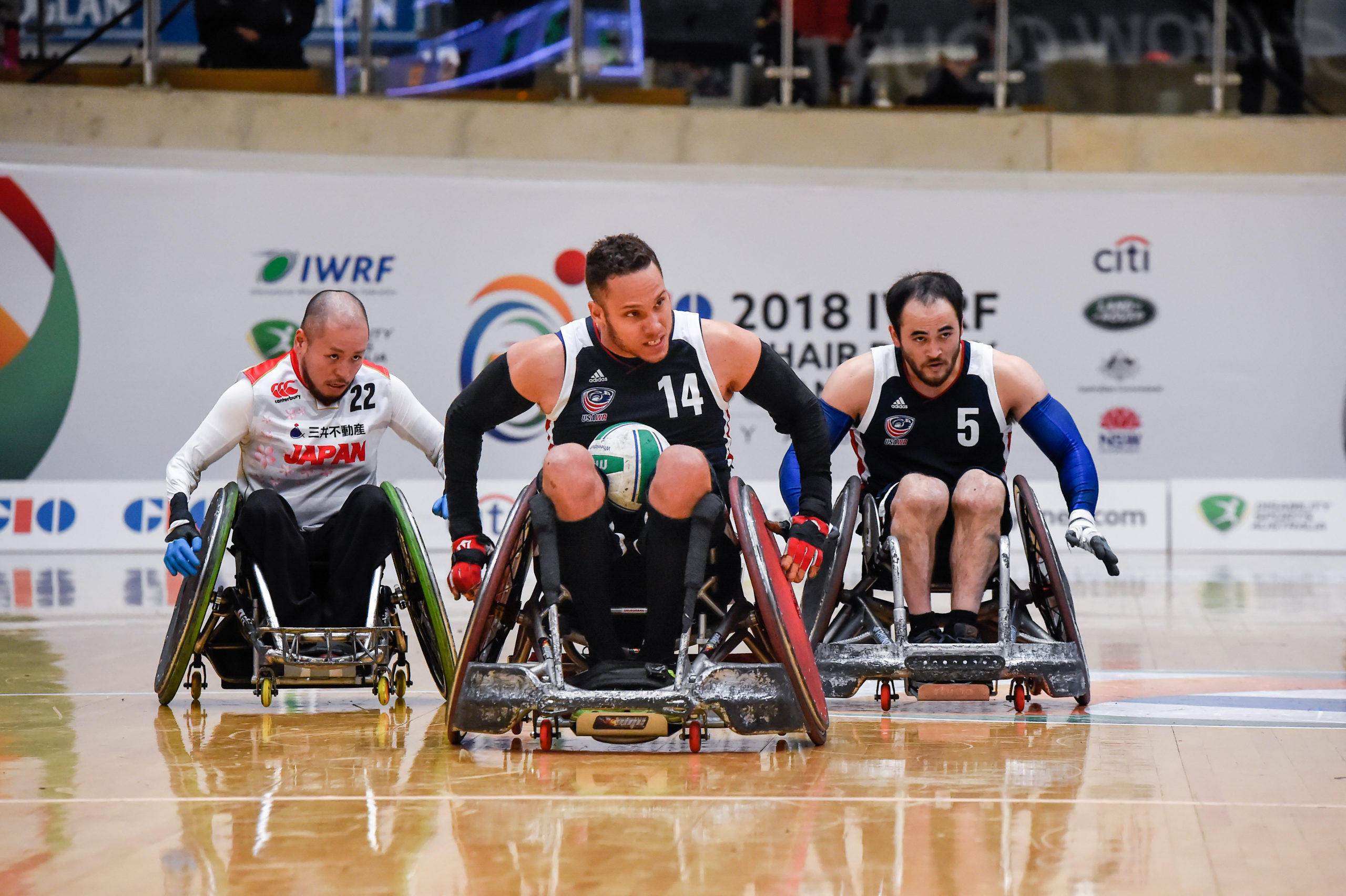 Male athletes playing wheelchair rugby