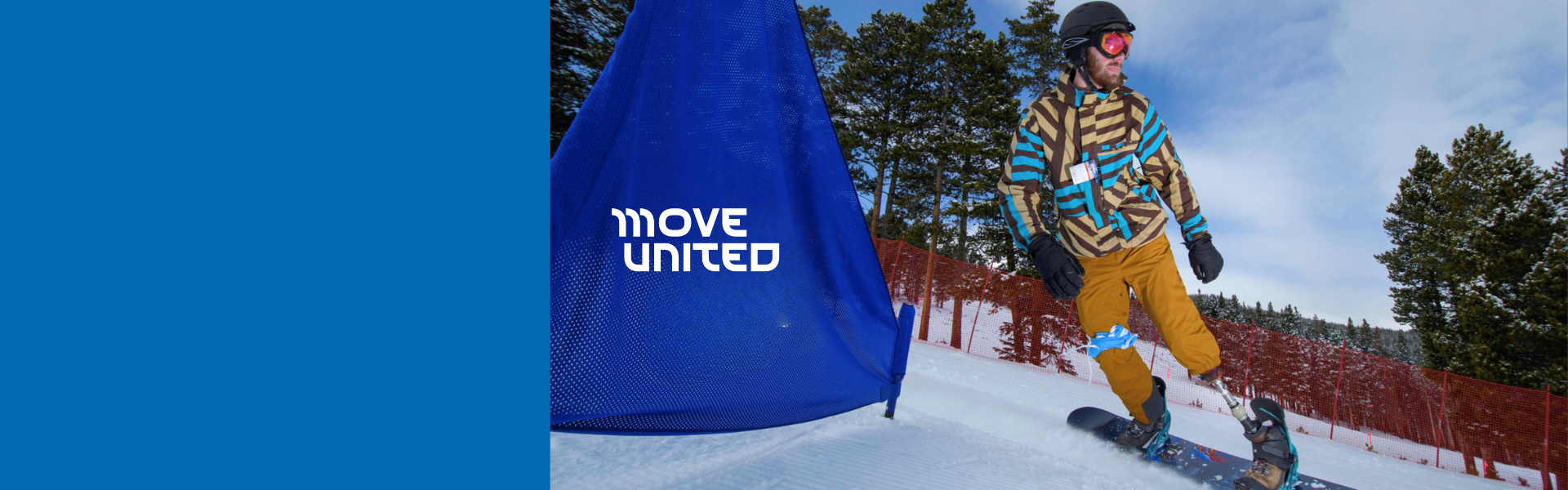 a person with a prosthetic leg snowboarding down a snow covered mountain