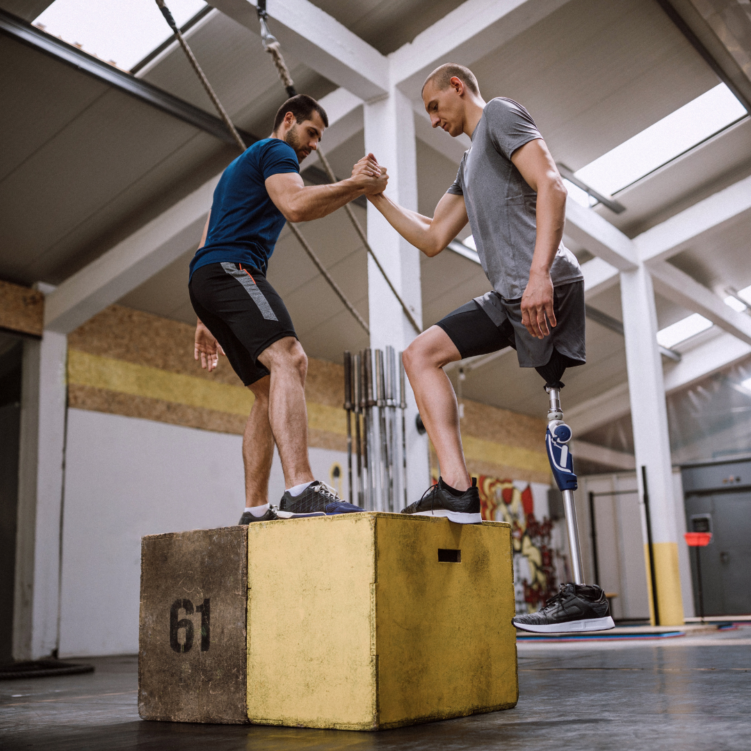 Two people participating in adaptive cross-fit