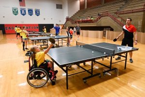 a youth wheelchair athlete playing table tennis
