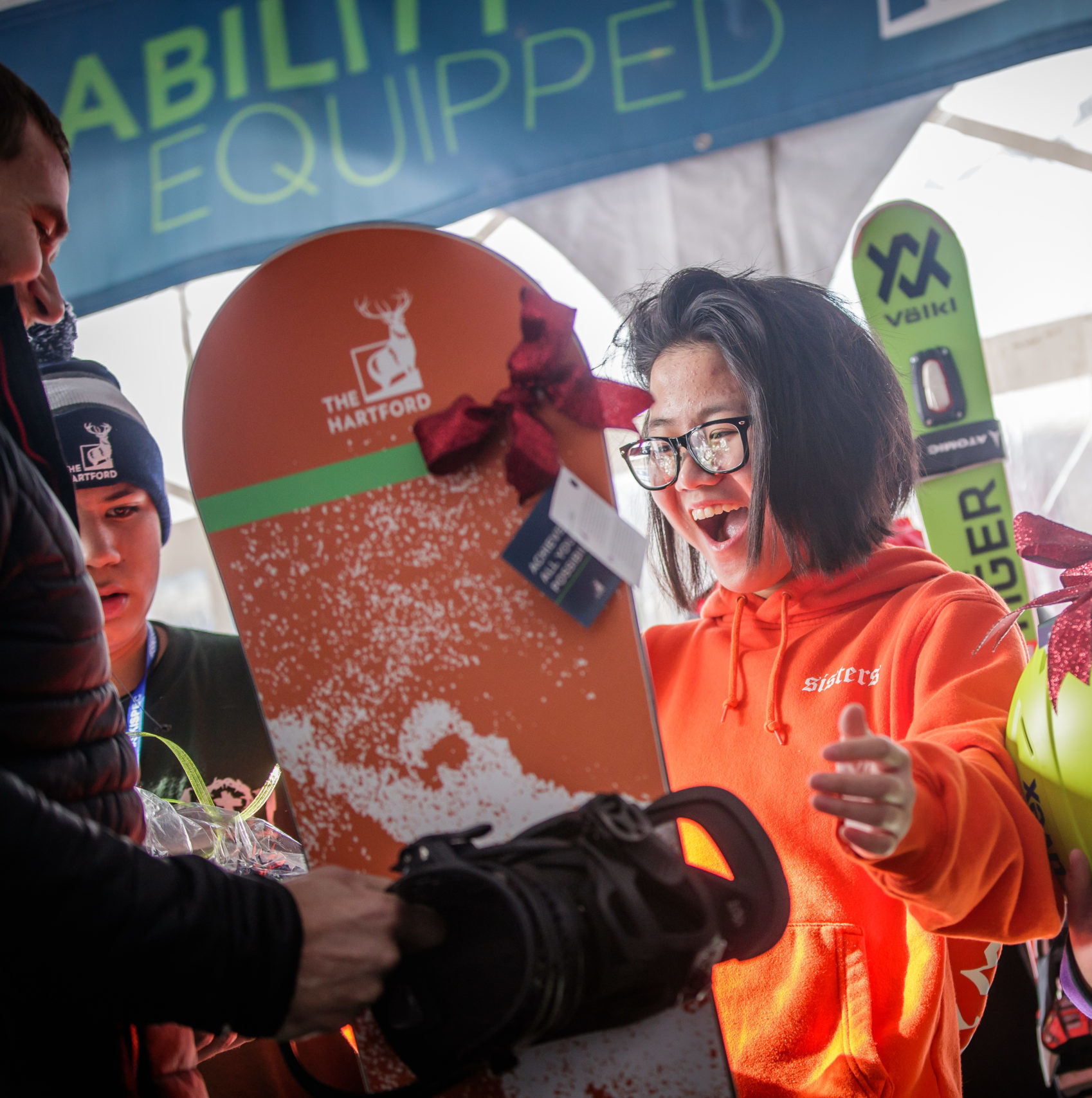 Girl receiving a snowboard