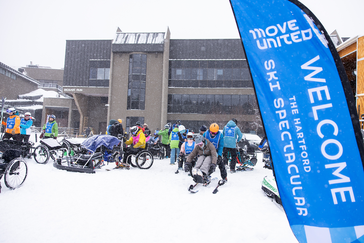 Ski Spec athletes gathered taking lessons nearby the lodging center