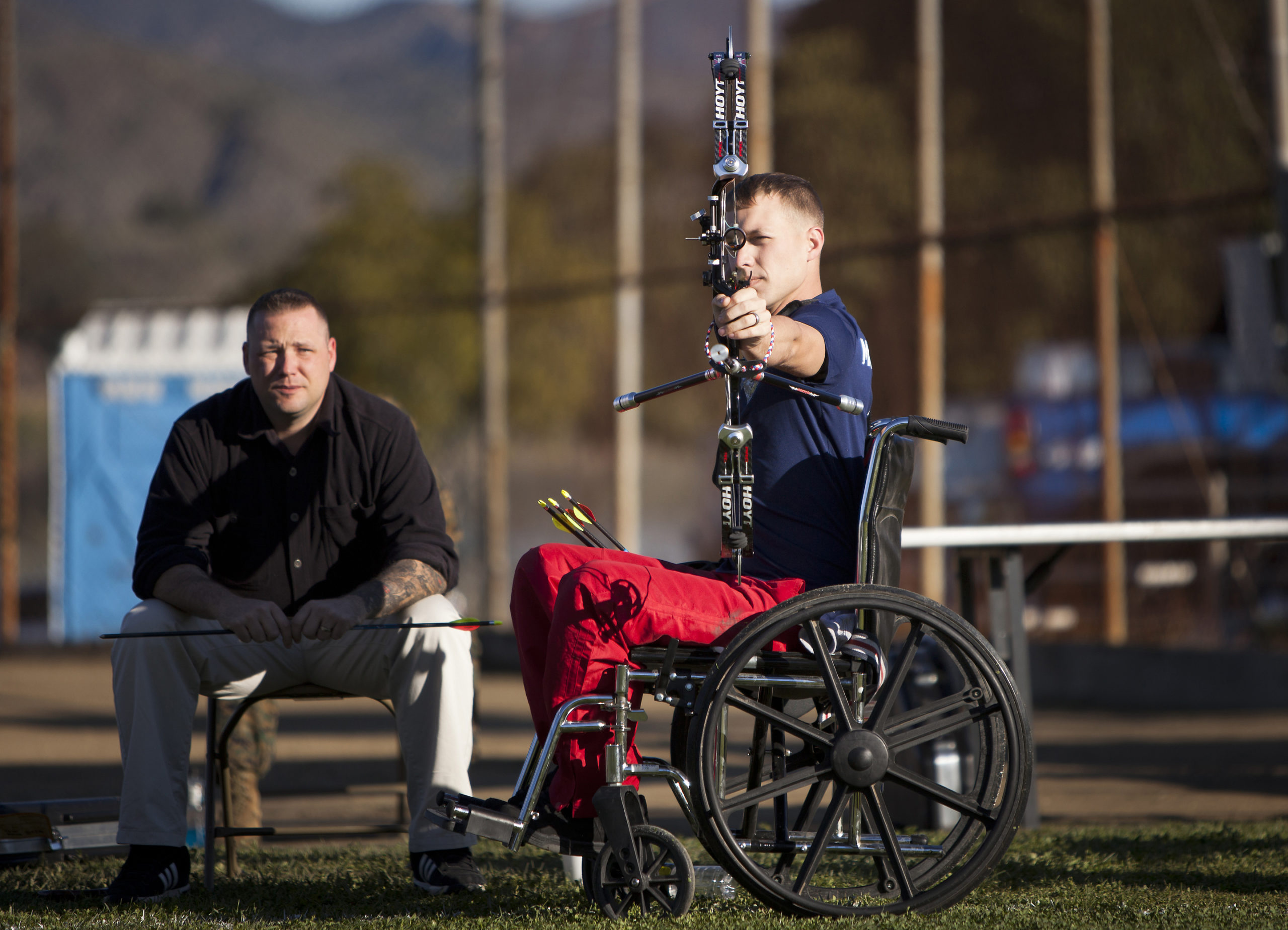 individual in a wheelchair shooting archery