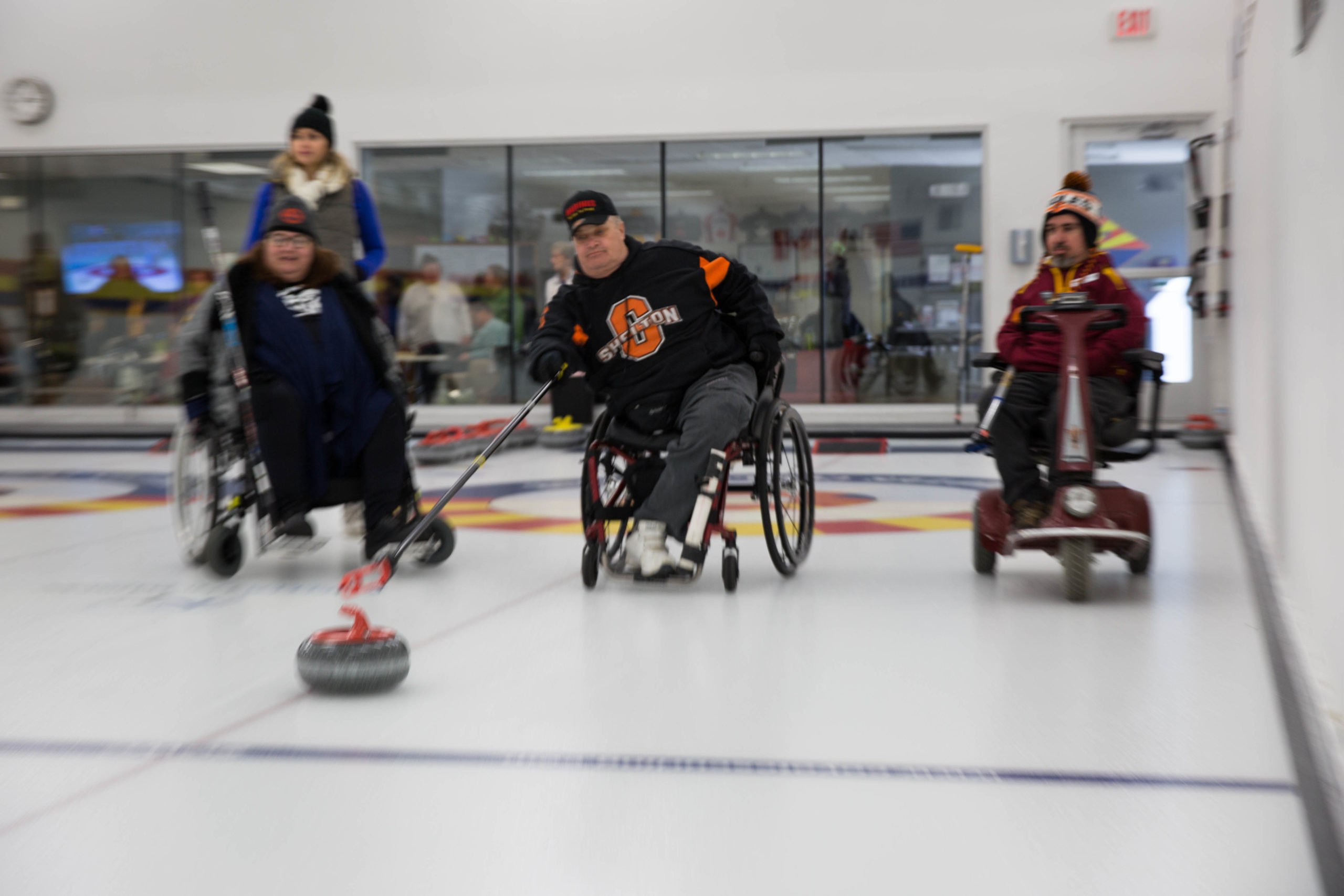 Athletes playing wheelchair curling