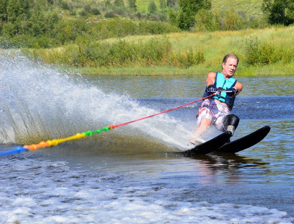 Male athlete water skiing