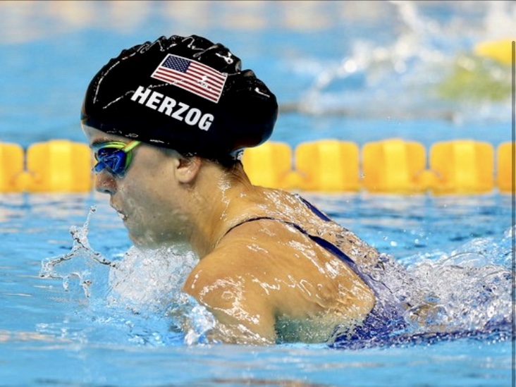 Sophia Herzog swimming in pool