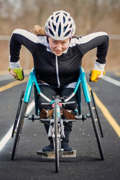 Athlete in racing wheelchair on track