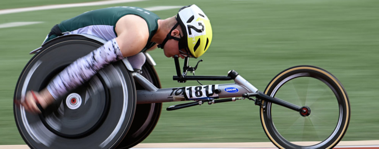 Athlete racing in racing wheelchair