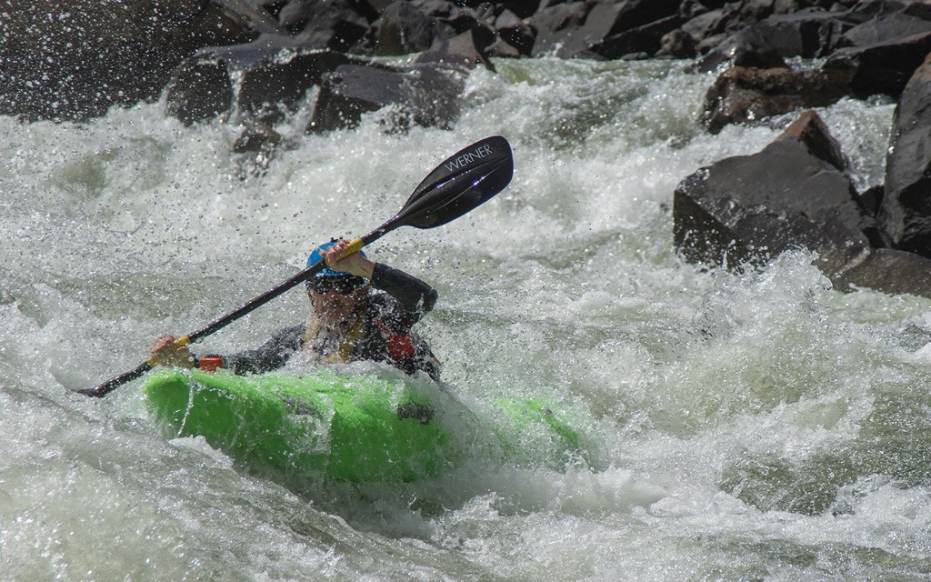 Athlete participating in kayak race.