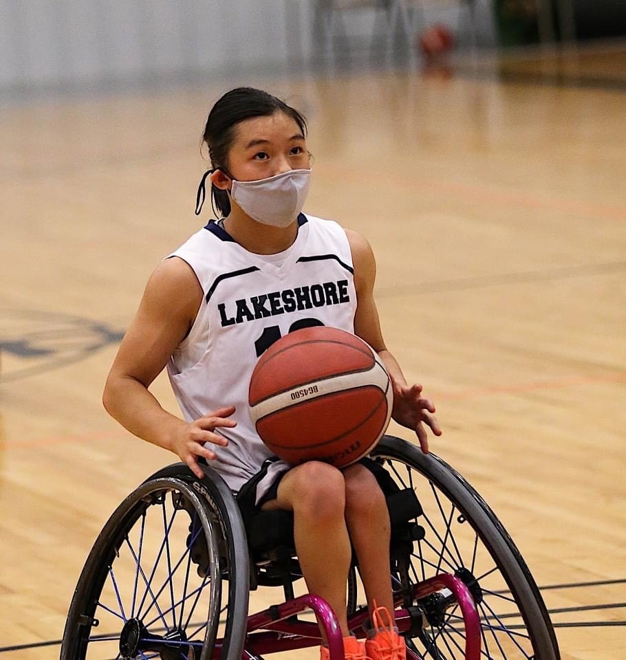 Athlete competing in wheelchair basketball.