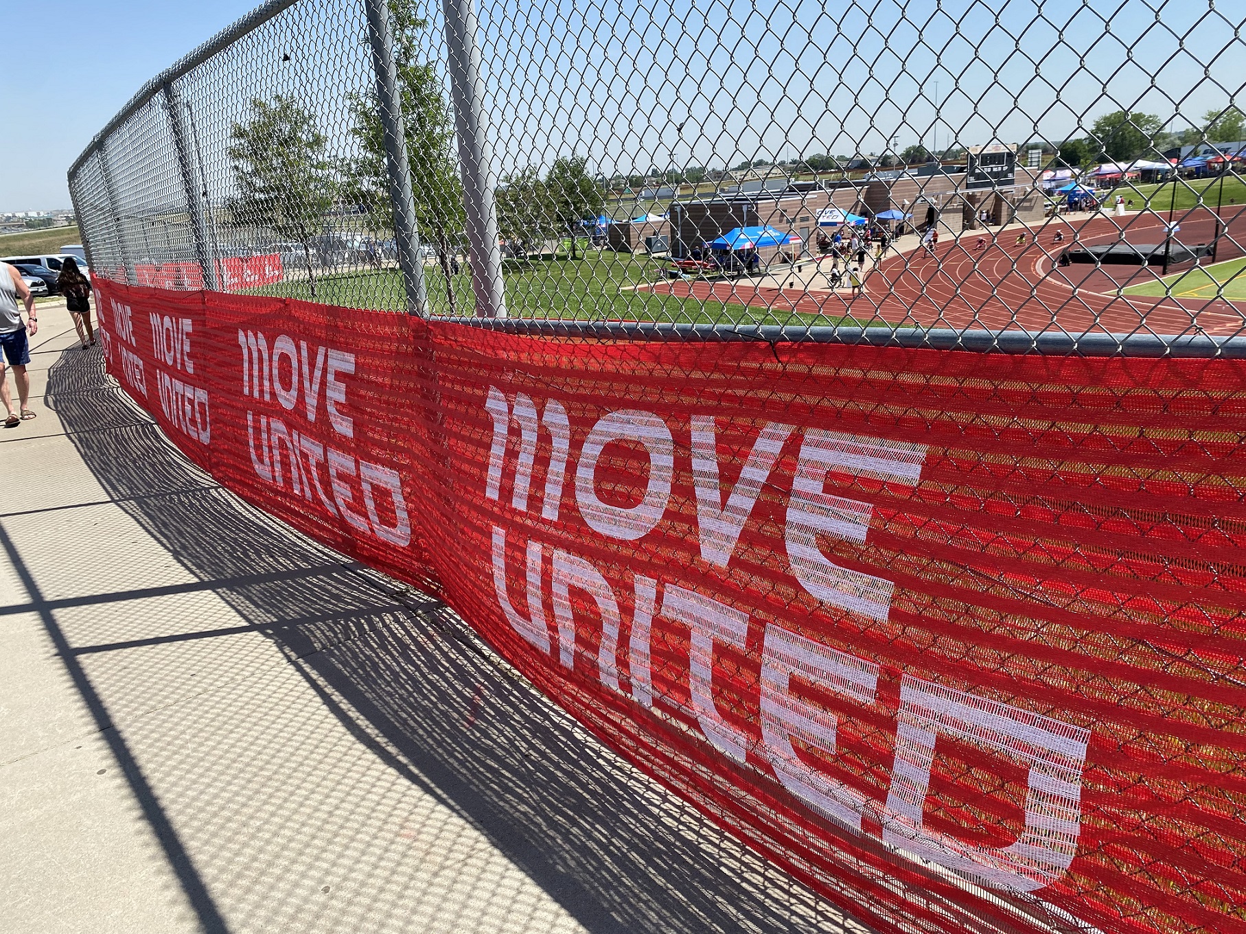 Move United red banner hung on fence