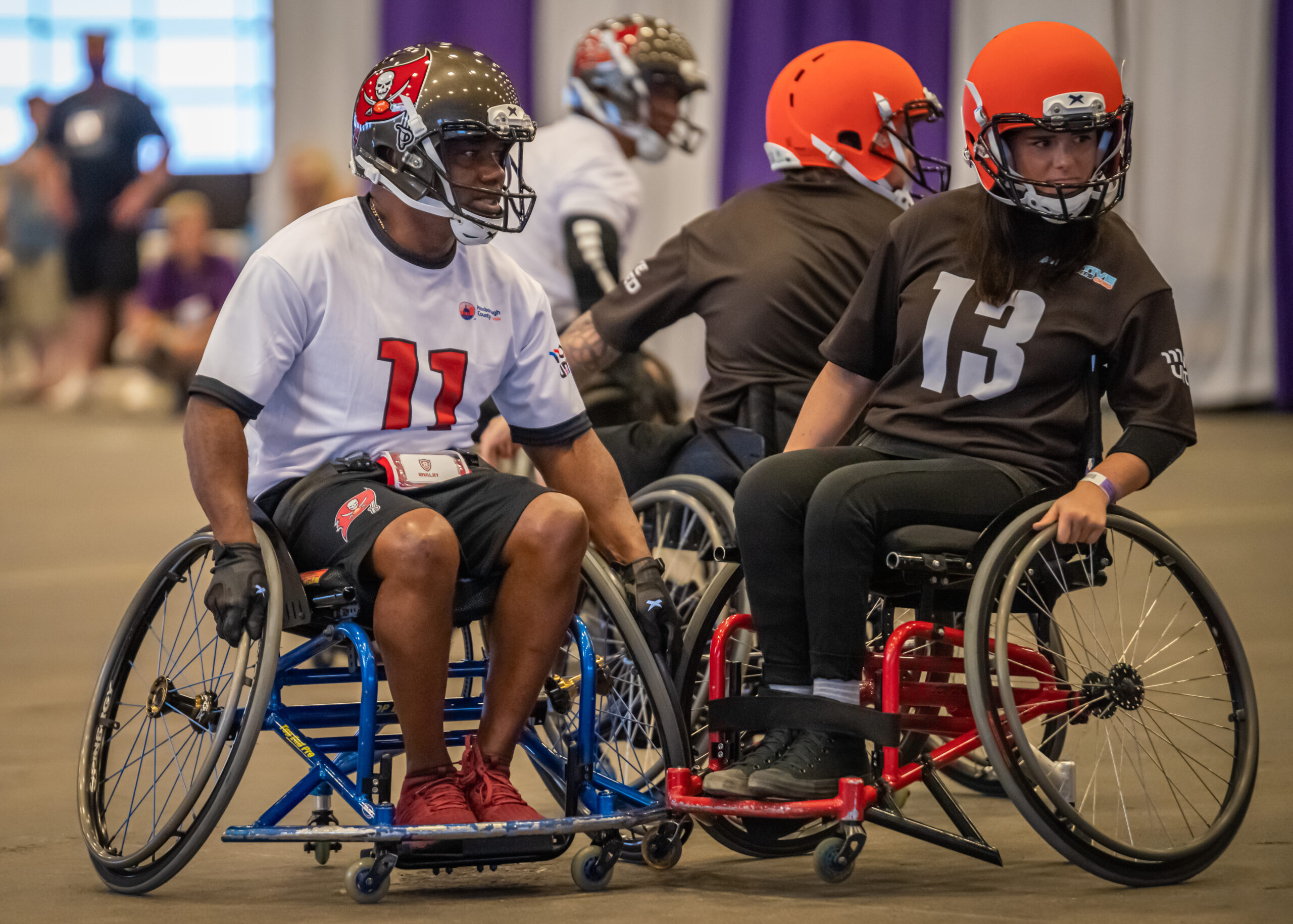 Two people playing wheelchair football