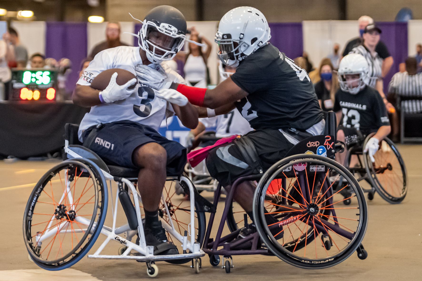 Two wheelchair football teams compete in a tournament