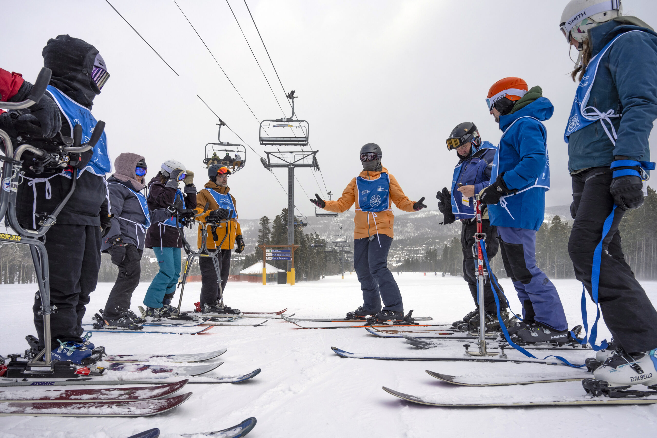 Group of people gathered outside in the snow
