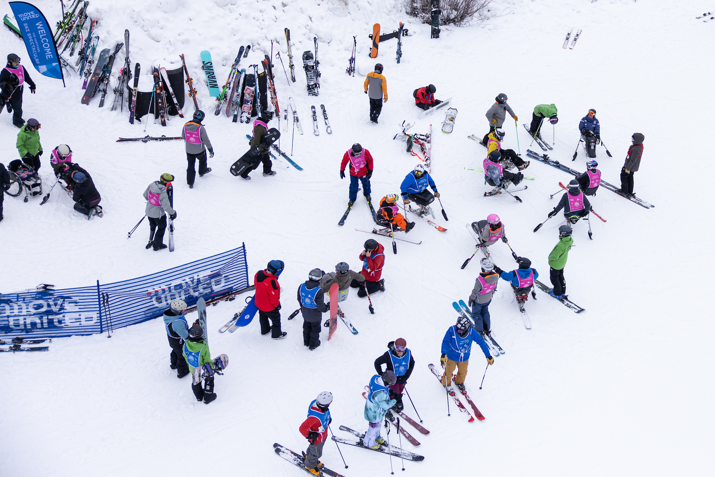 Two people snowboarding with heavy snow coming down
