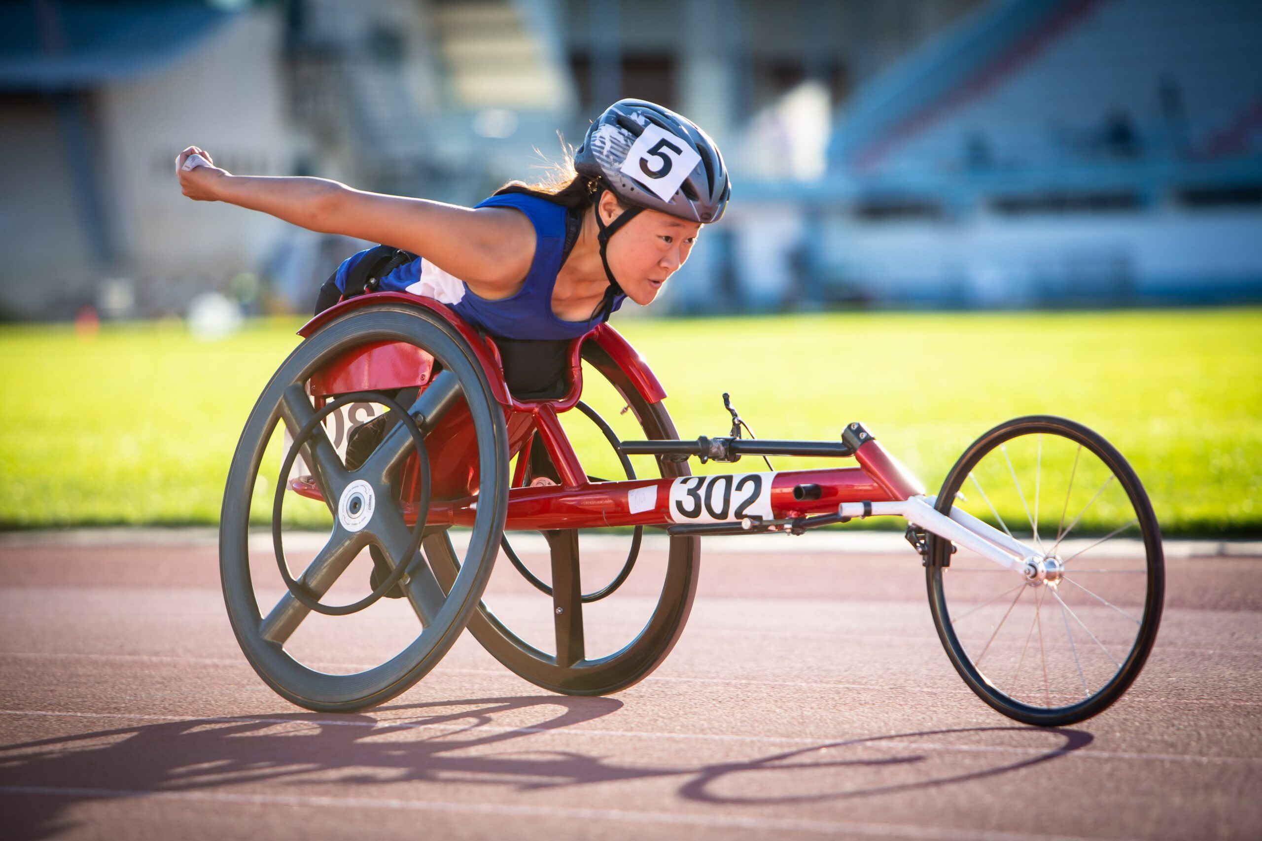 Young wheelchair racer on the track