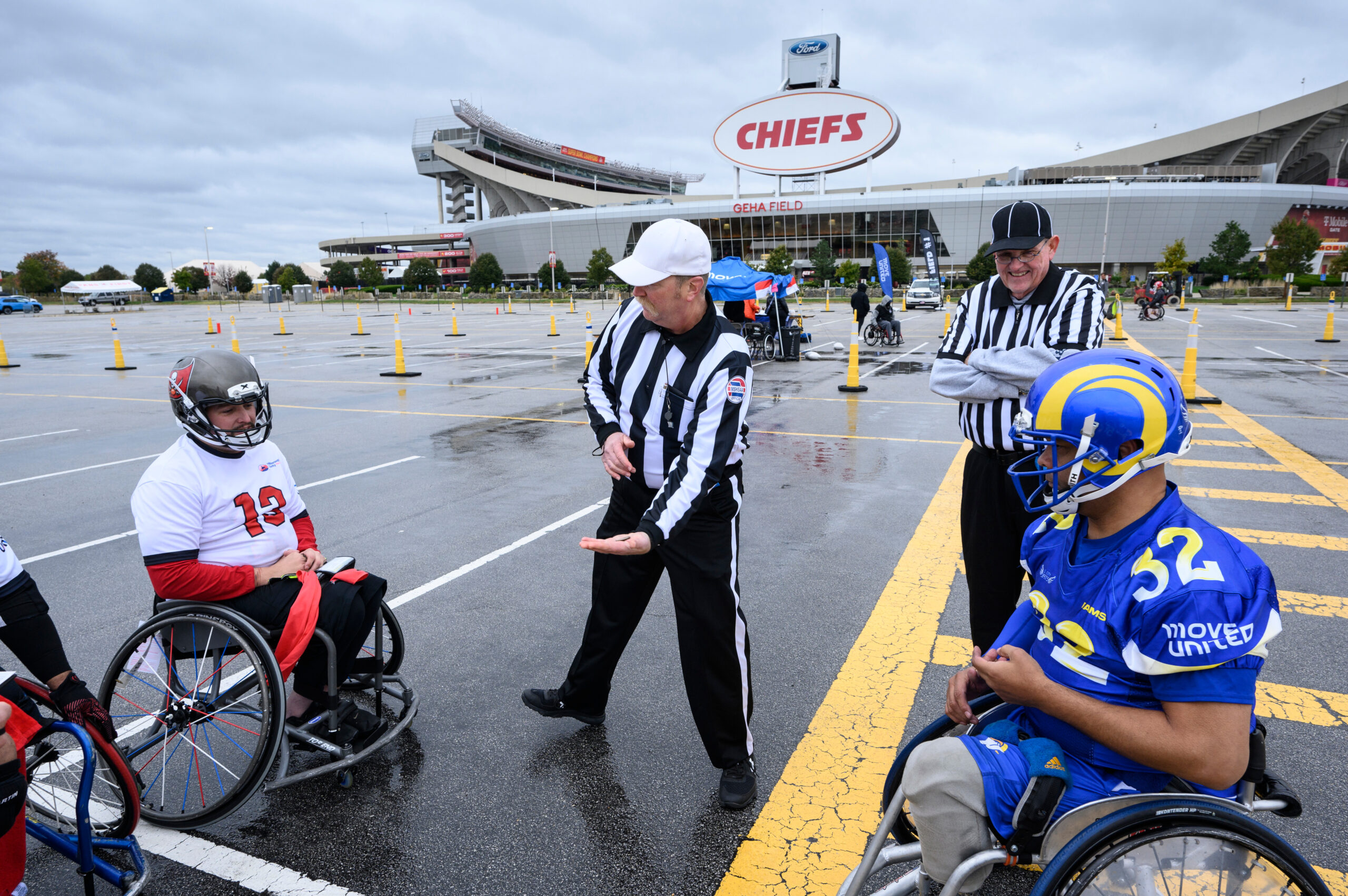 Header Image of official and wheelchair football athletes during coin toss.
