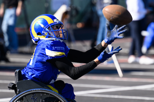 Rams player catching the football