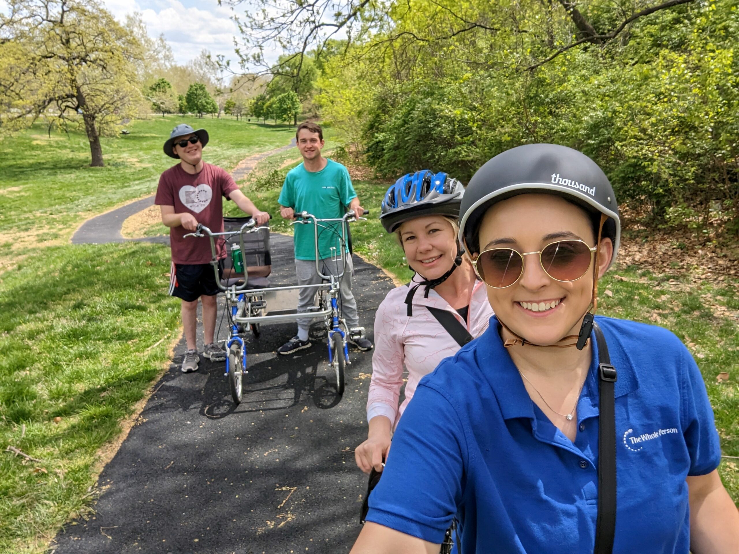 Four people bike riding on an outdoor track