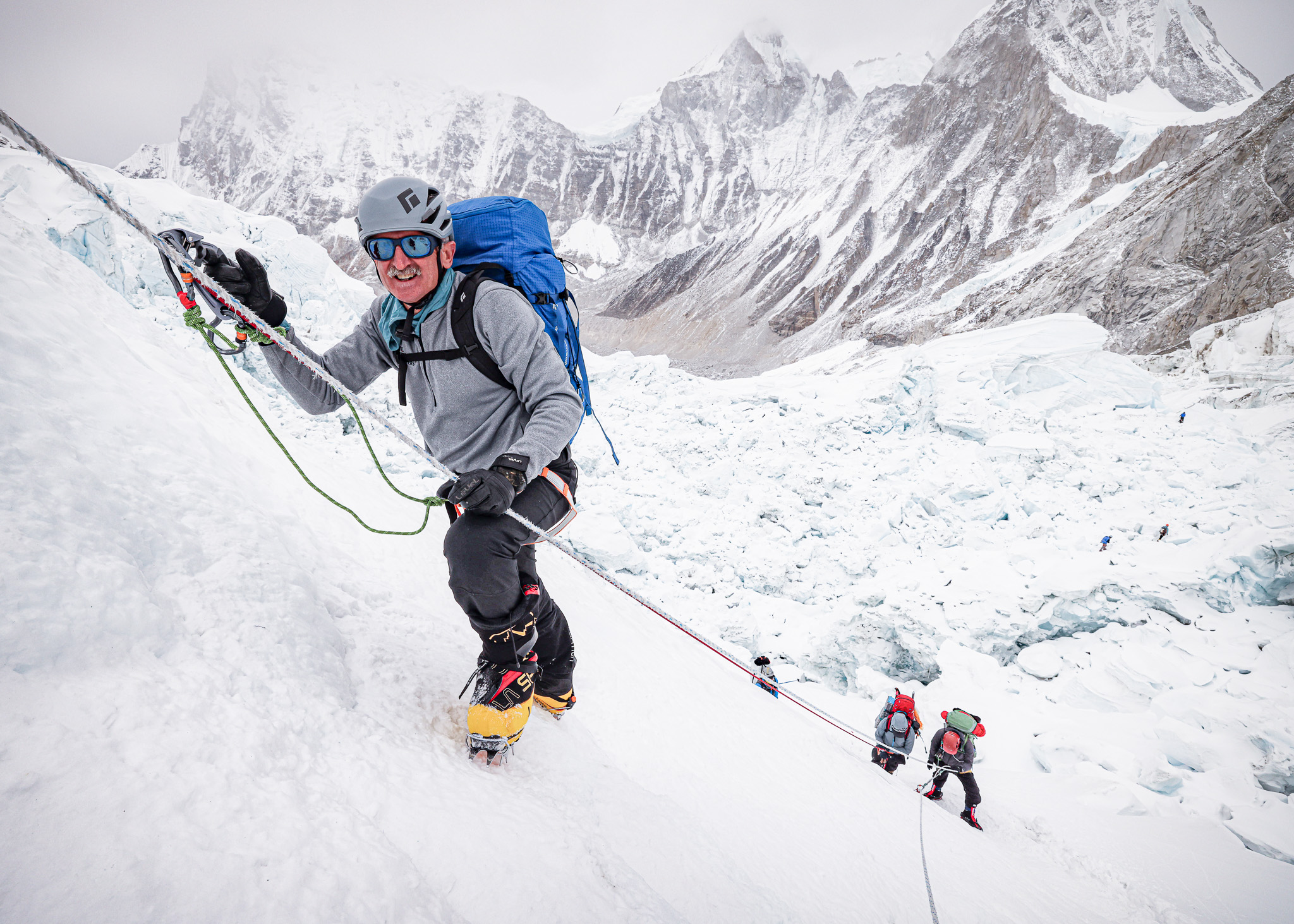 Lonnie Bedwell scaling a steep slope on Mount Everest