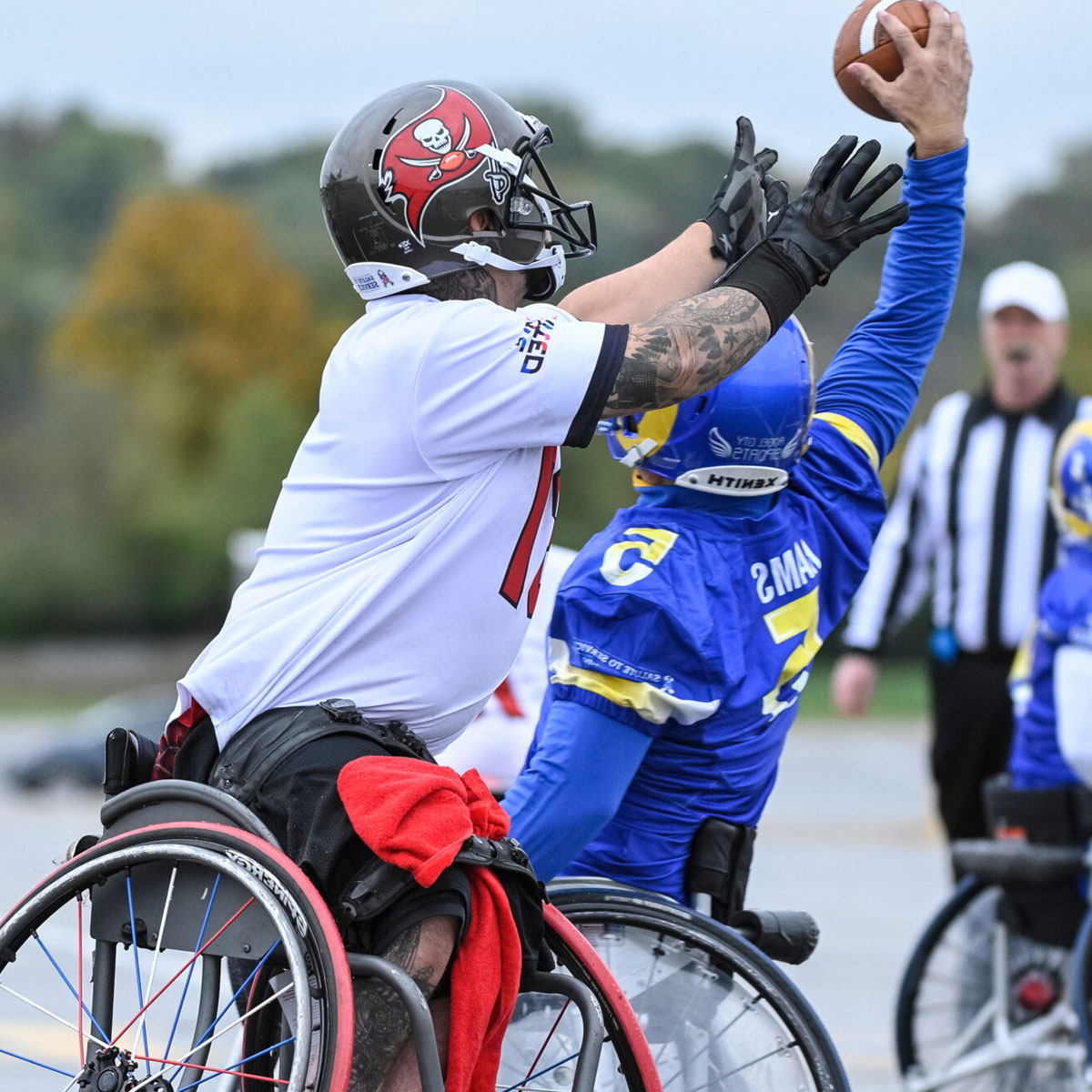 Image of person playing football in wheelchair