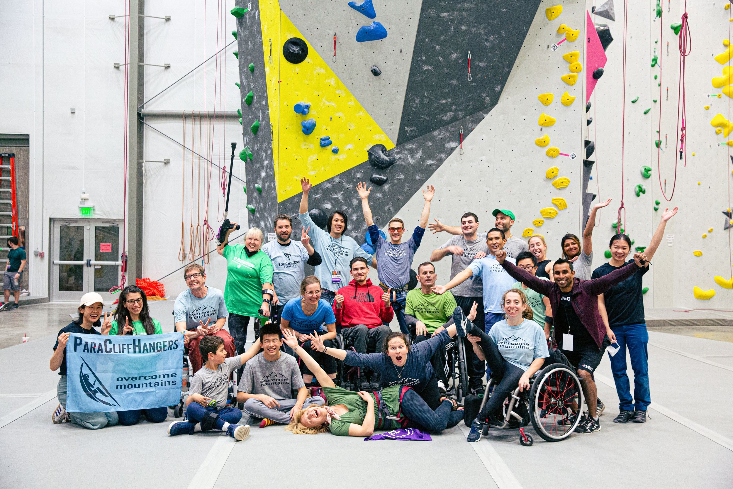 Group poses for photo at a climbing gym
