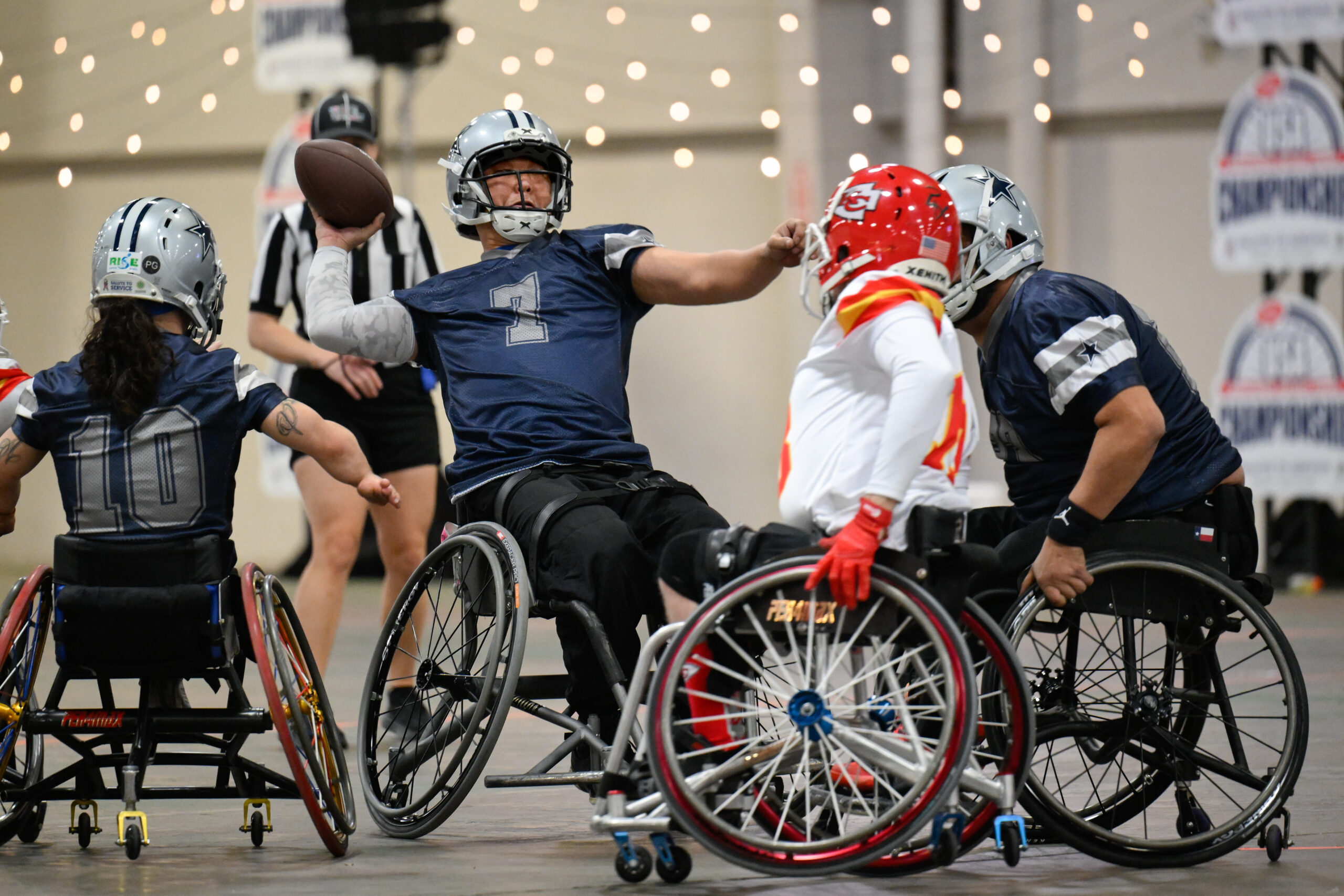 Dallas Cowboys player Jason Rainey launches a pass against the Kansas City Chiefs during the USA Wheelchair Football League Championship, a program of Move United, Tuesday, Feb. 6, 2024 in Dallas, TX. (Photo by Reed Hoffmann for Move United)