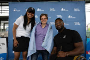 The Hartford Human Achievement Award recipient, Elicia Meairs, receiving her award beside Matt Scott, Paralympian wheelchair basketball, and Monique Higgs, The Hartford