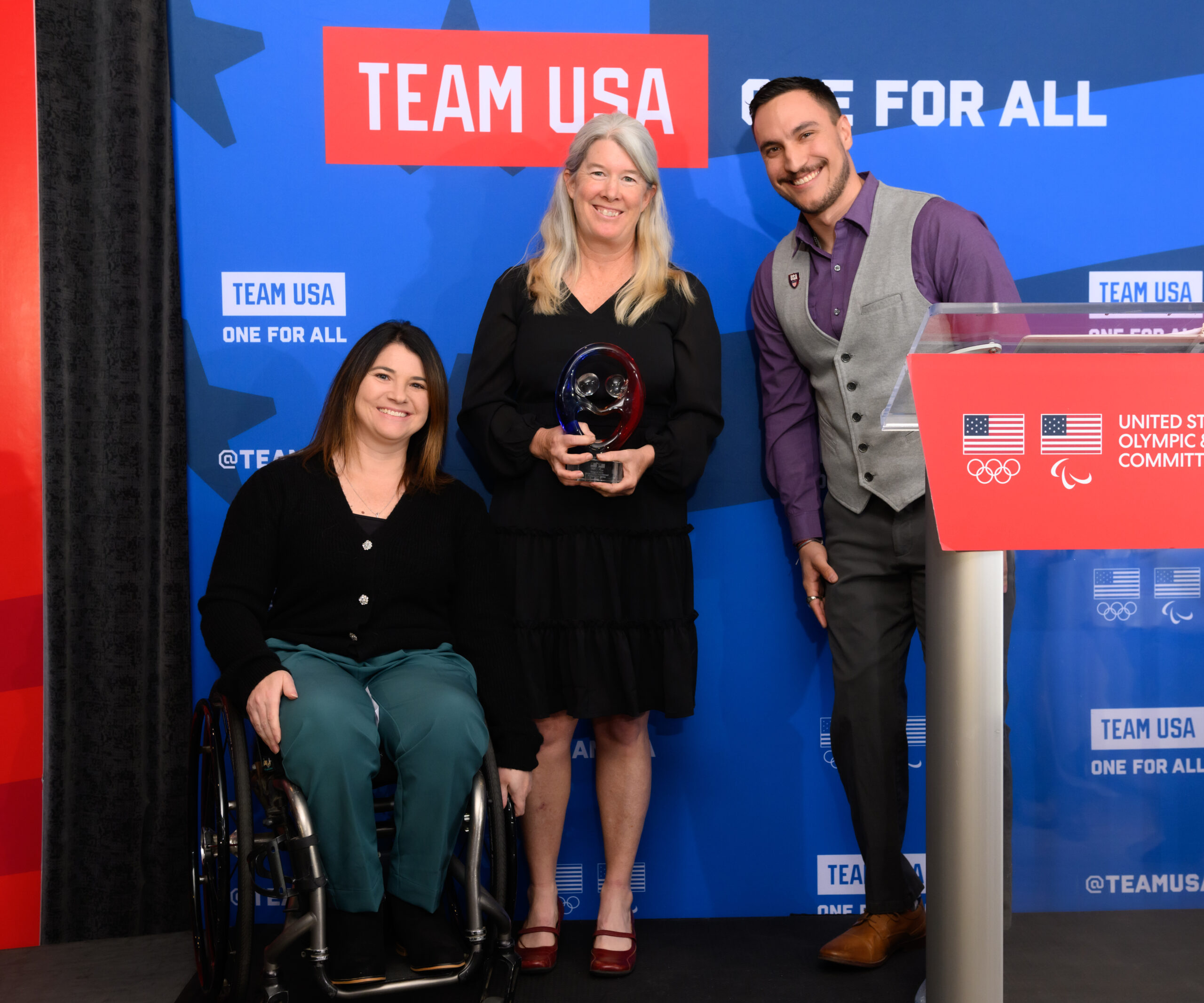 Tyler Carter presents the Rings of Gold Award to Jessie Cloy and Susan Rossi with Move United