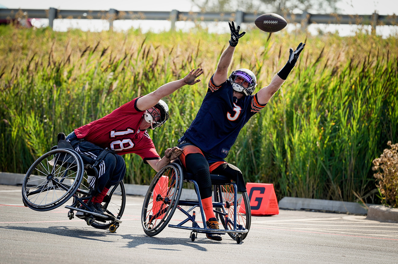 Chicago Bears Wheelchair Football Team Athlete Reaching out to catch a pass