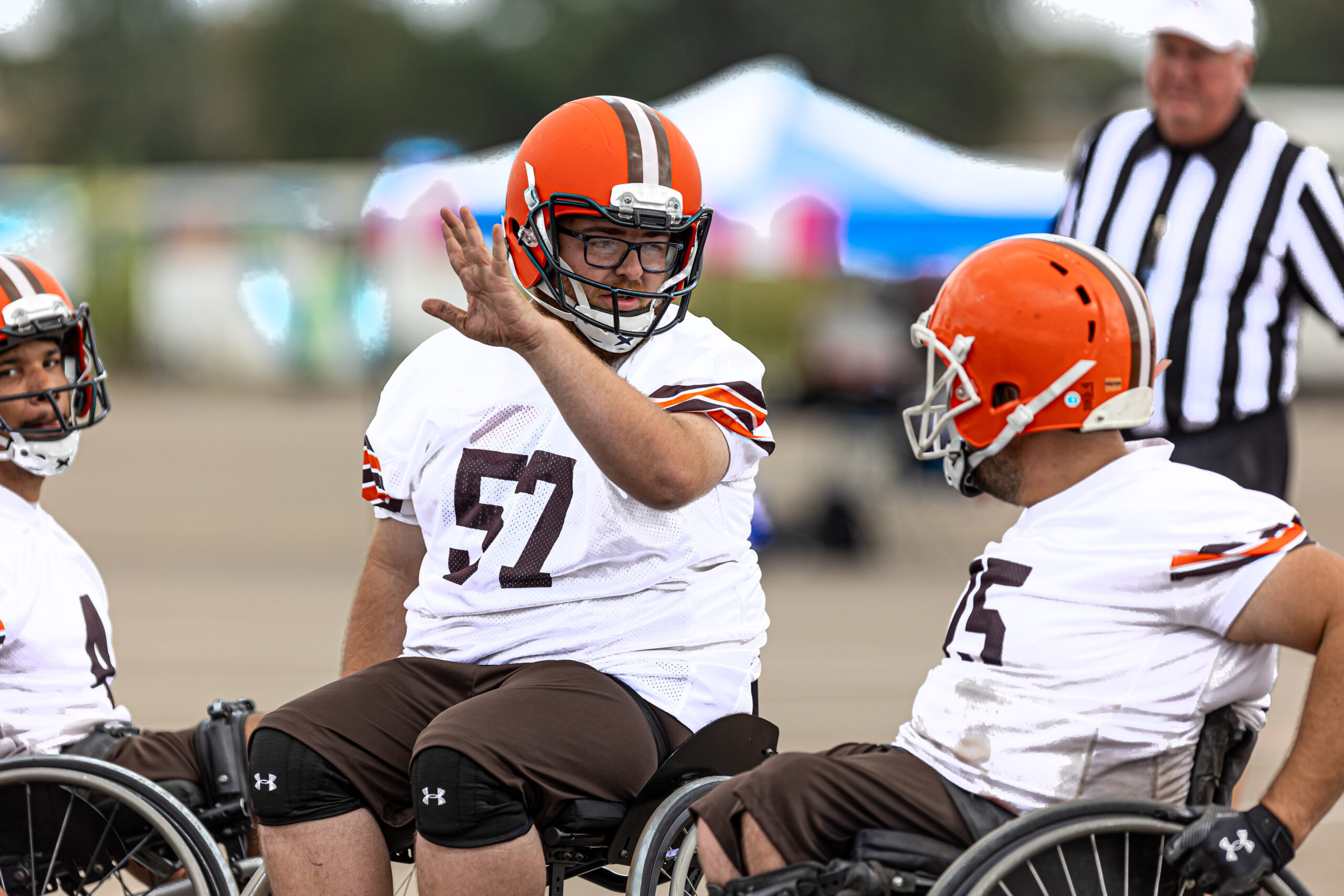 Cleveland Browns Wheelchair Football Athletes Talking strategy on the field