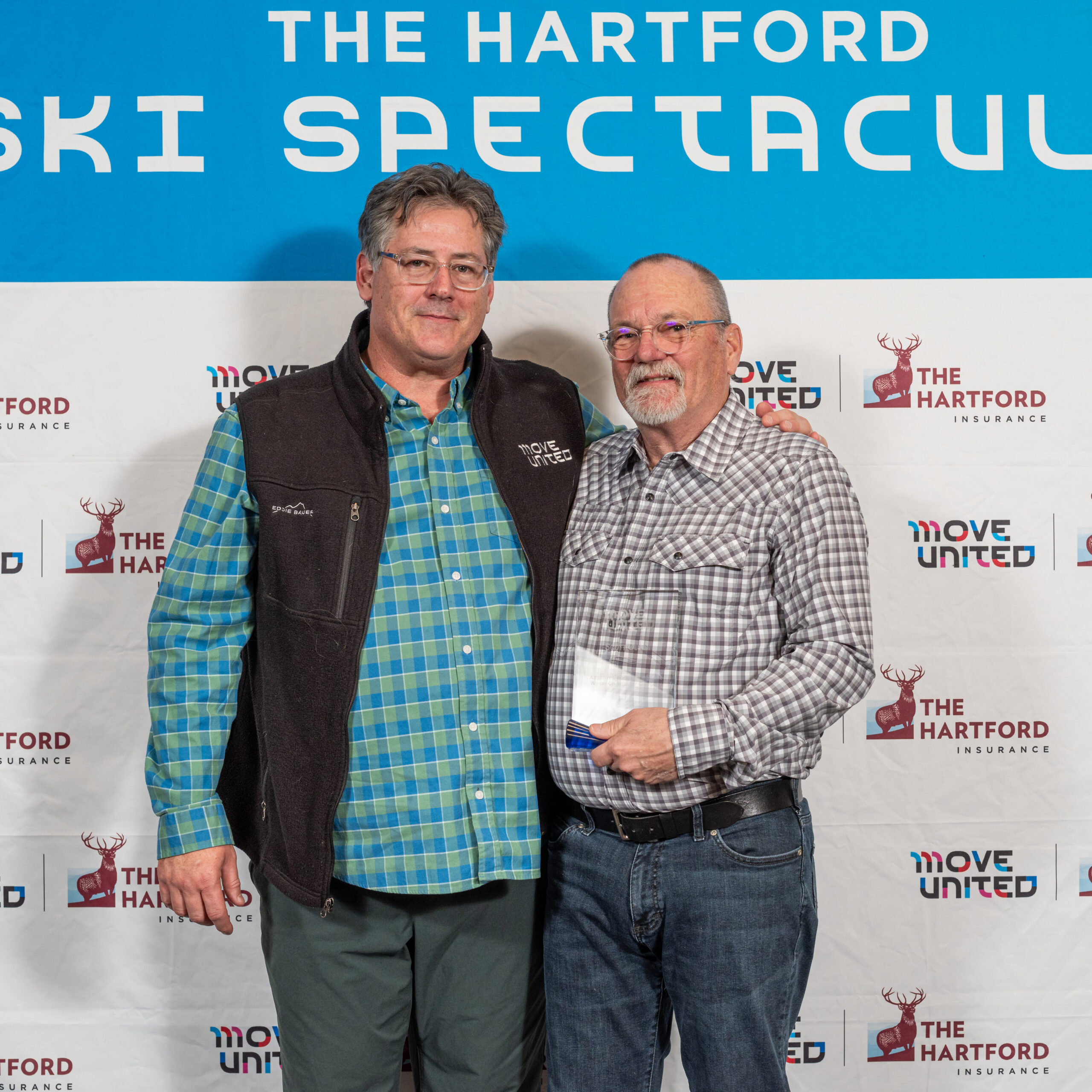 Scott Olson accepting the Hall of Fame Award from Glenn Merry