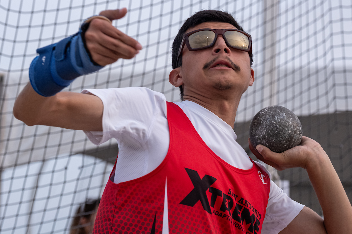 Close up photo of athlete throwing shot put