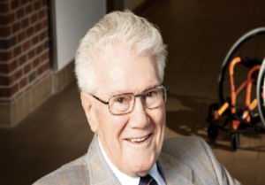 Dr. Timothy Nugent sitting down and facing camera.