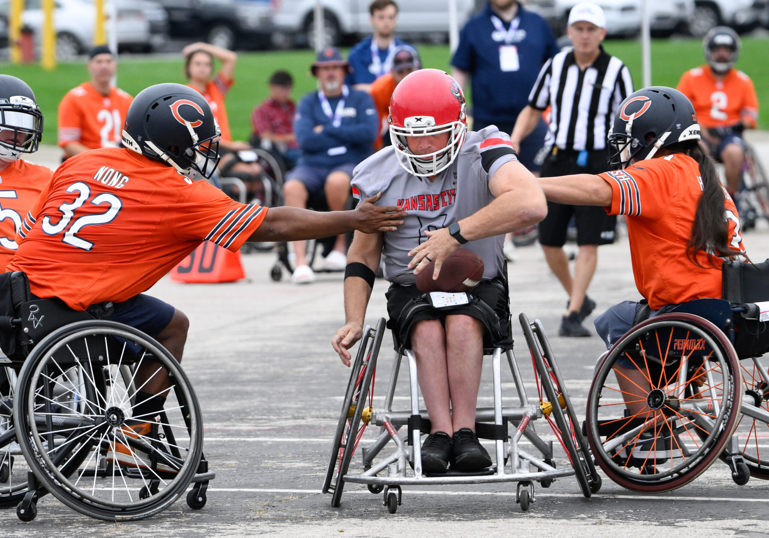 Image of Bears team tackling Smoke athlete in football game.