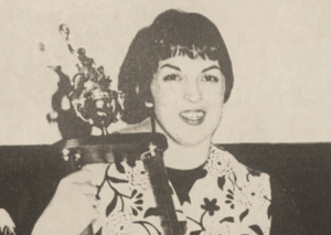 Jan Little holding a trophy