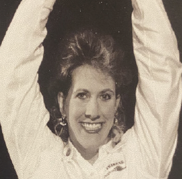 Jean Driscoll holding up a trophy