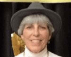 Jeannie Reiner Senter smiling at the camera wearing a hat