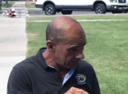 Carlos Moleda looking down.