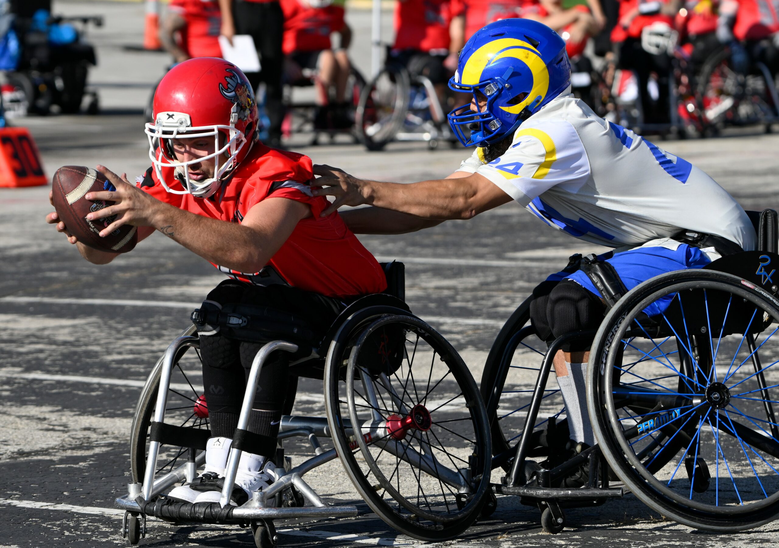 USAWFL Rams athlete tackling a Chiefs athlete